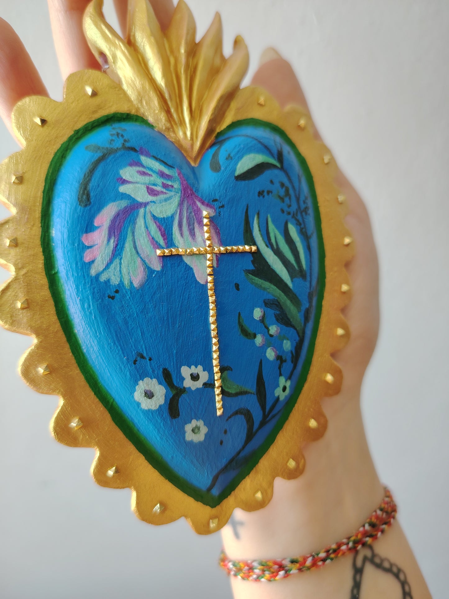 Ex voto croce borchie