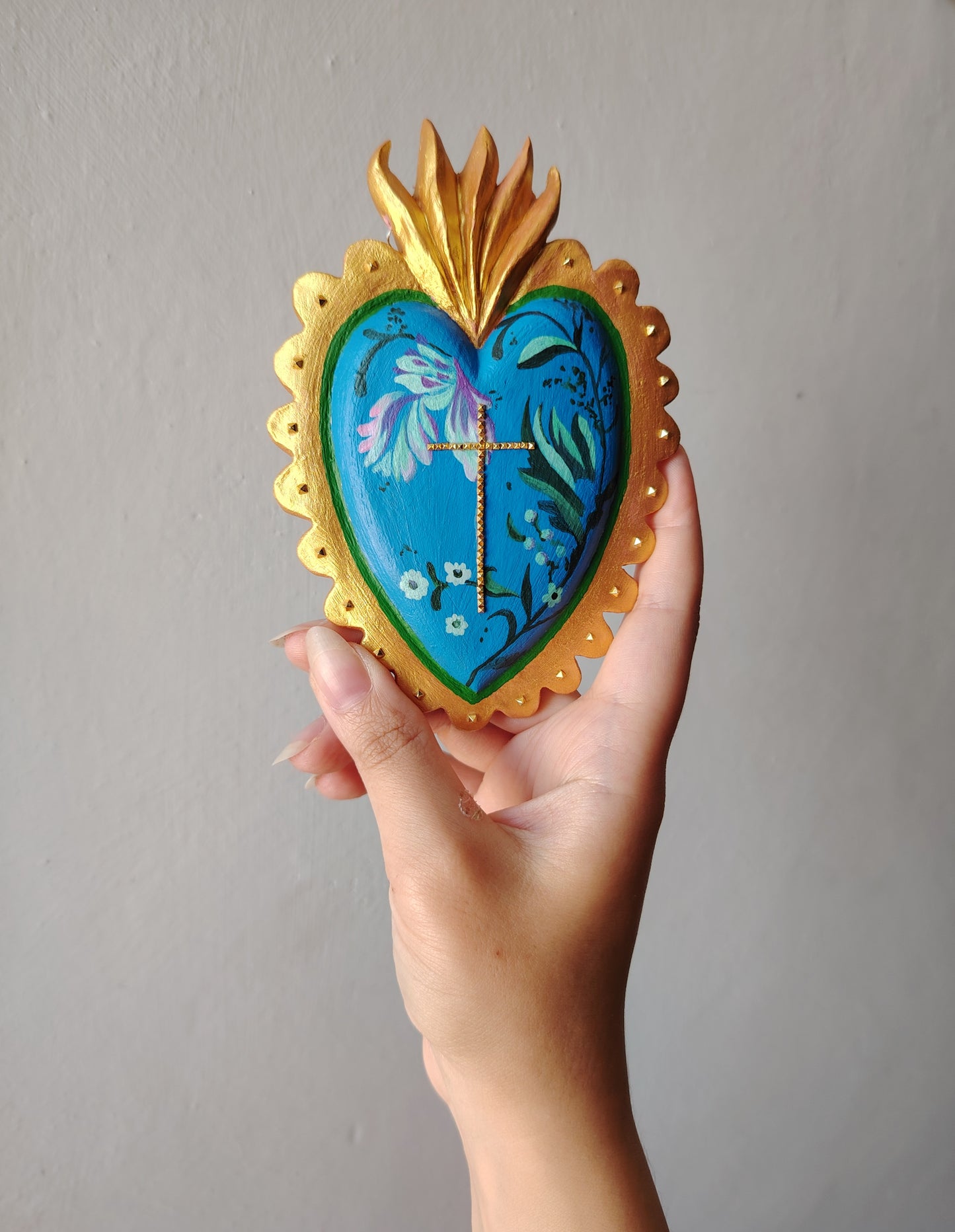 Ex voto croce borchie